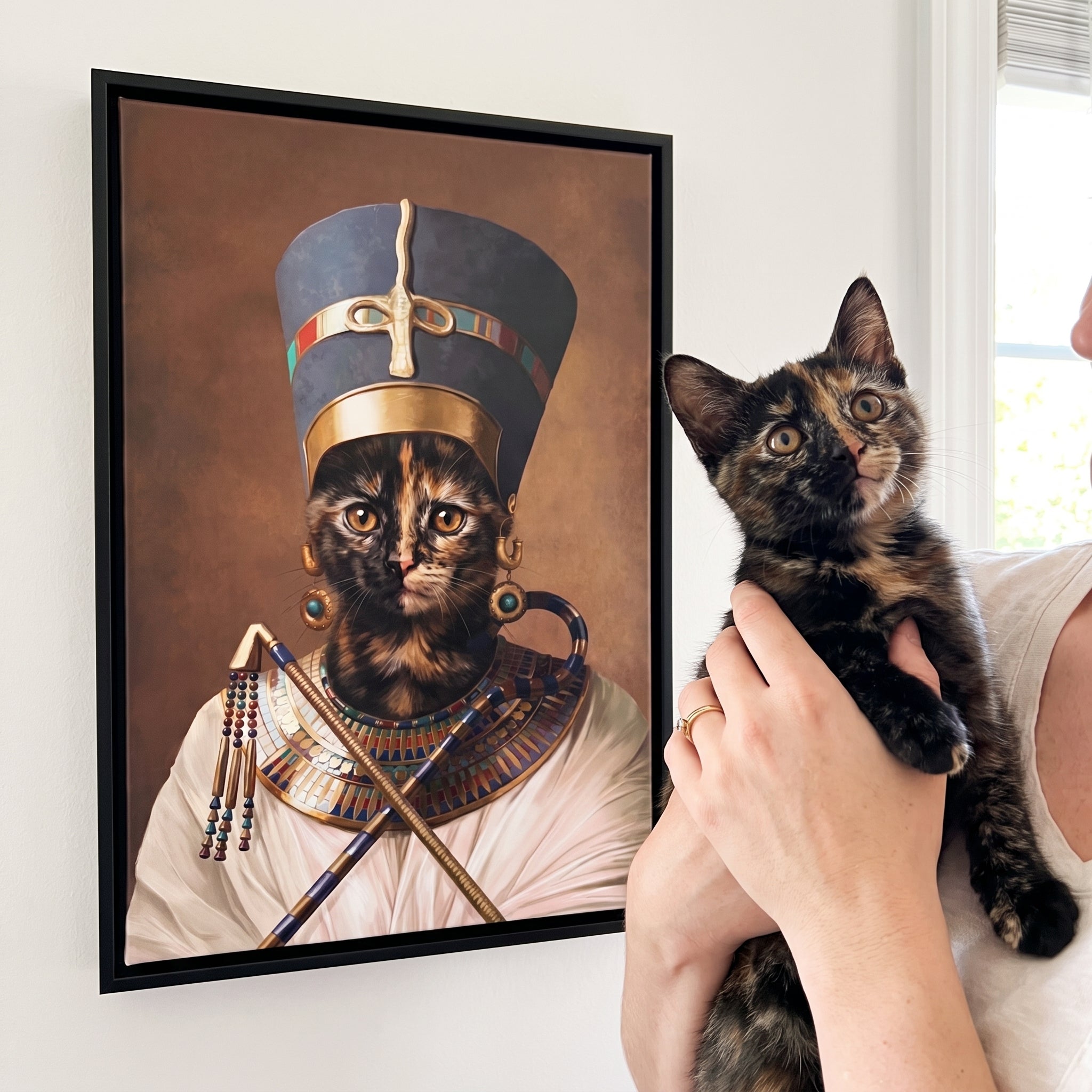 Tortoiseshell cat next to its The Egyptian Queen custom pet canvas