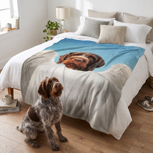 Cavalier King Charles spaniel with The Angel custom pet blanket: on the bed