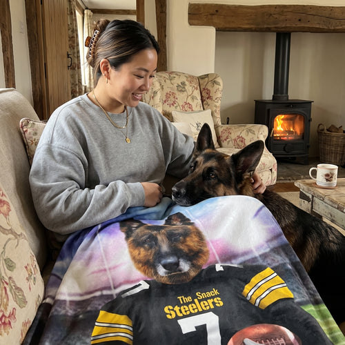 German shepherd with The Snack Steelers custom pet blanket: owner + pet on sofa